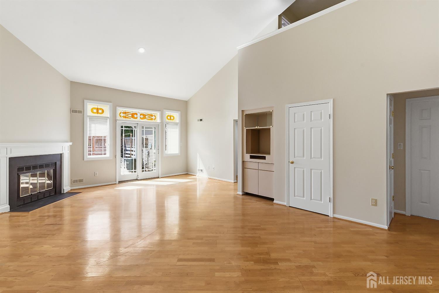 34 Rutland Lane, Unit B Monroe Township, NJ 08831 - Photo 13 of 45 a view of an empty room with a window and fireplace