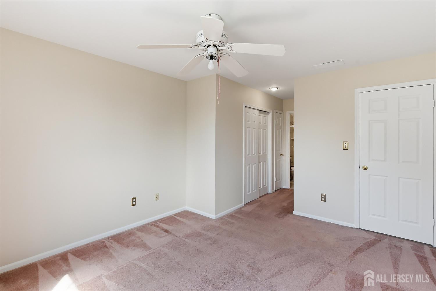 34 Rutland Lane, Unit B Monroe Township, NJ 08831 - Photo 22 of 45 a view of a room with a ceiling fan