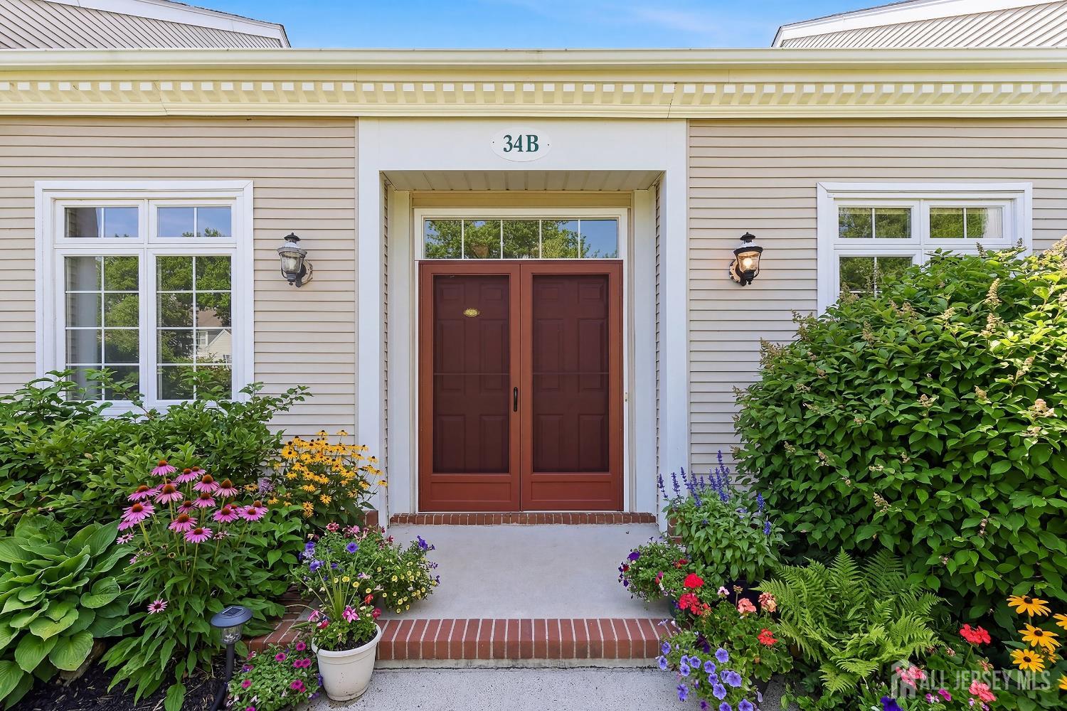 34 Rutland Lane, Unit B Monroe Township, NJ 08831 - Photo 3 of 45 front view of a house with a potted plant