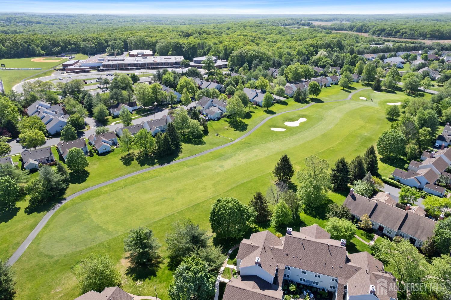 34 Rutland Lane, Unit B Monroe Township, NJ 08831 - Photo 36 of 45 an aerial view of residential houses with outdoor space and swimming pool