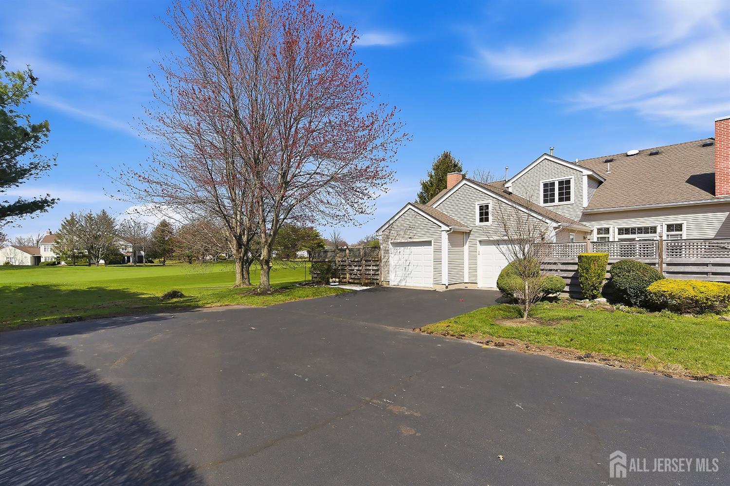 34 Rutland Lane, Unit B Monroe Township, NJ 08831 - Photo 4 of 45 a view of the house with a big yard and large trees