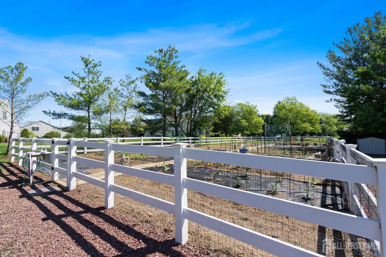 34 Rutland Lane, Unit B Monroe Township, NJ 08831 - Photo 42 of 45 a view of a balcony with wooden floor and fence