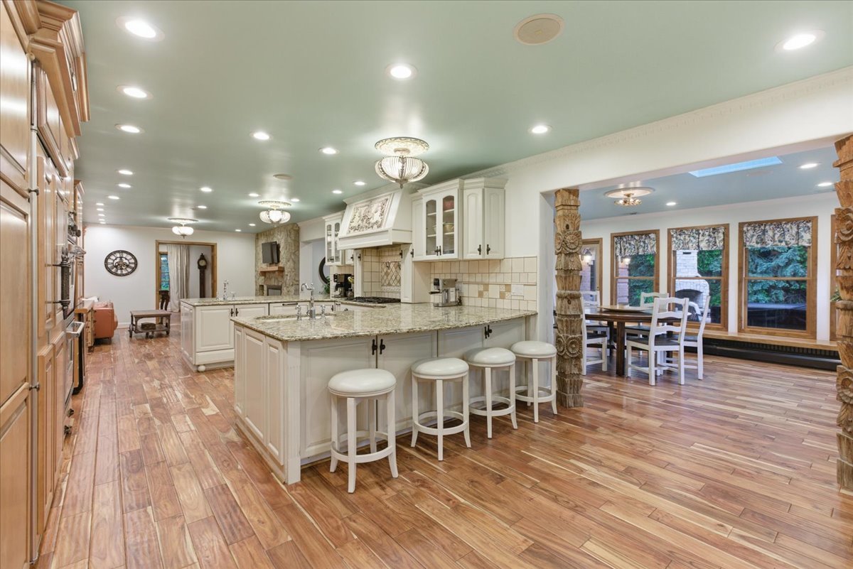 39 Mockingbird Lane Oak Brook, IL 60523 - Photo 15 of 57 a large kitchen with lots of counter space and dining table chairs
