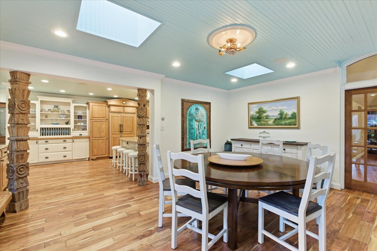 39 Mockingbird Lane Oak Brook, IL 60523 - Photo 16 of 57 a view of a dining room with furniture window and wooden floor