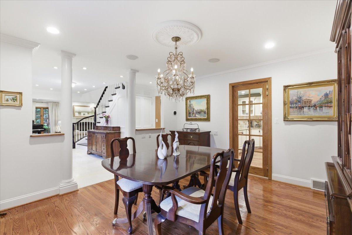 39 Mockingbird Lane Oak Brook, IL 60523 - Photo 22 of 57 a view of a dining room with furniture and wooden floor