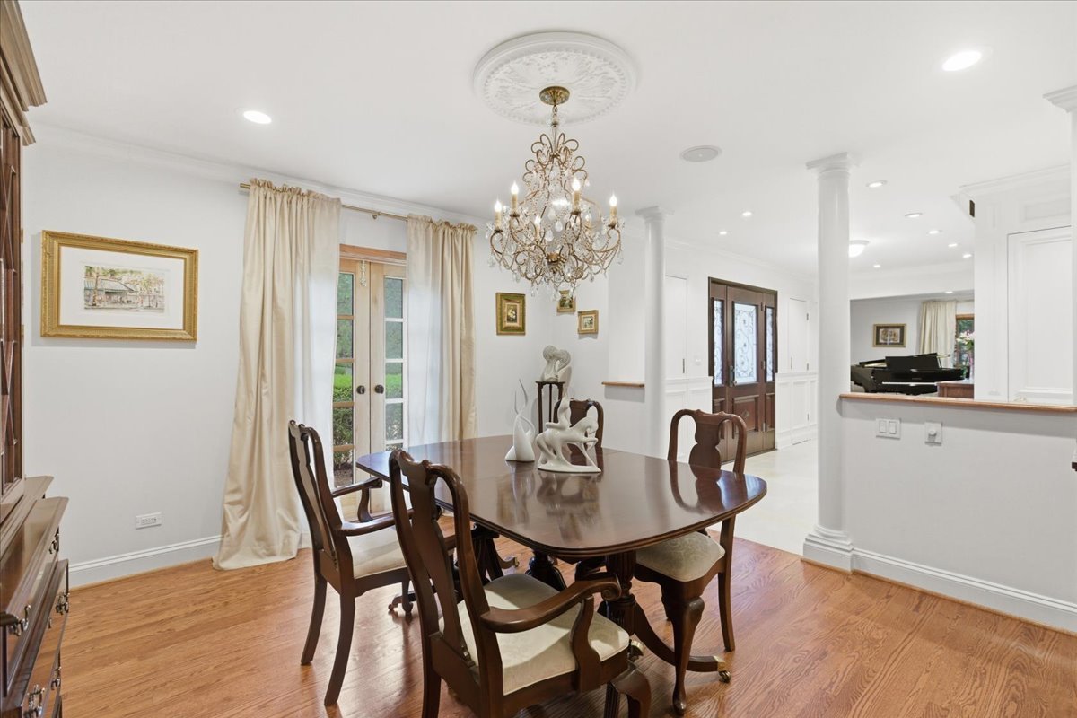 39 Mockingbird Lane Oak Brook, IL 60523 - Photo 23 of 57 a view of a dining room with furniture and wooden floor