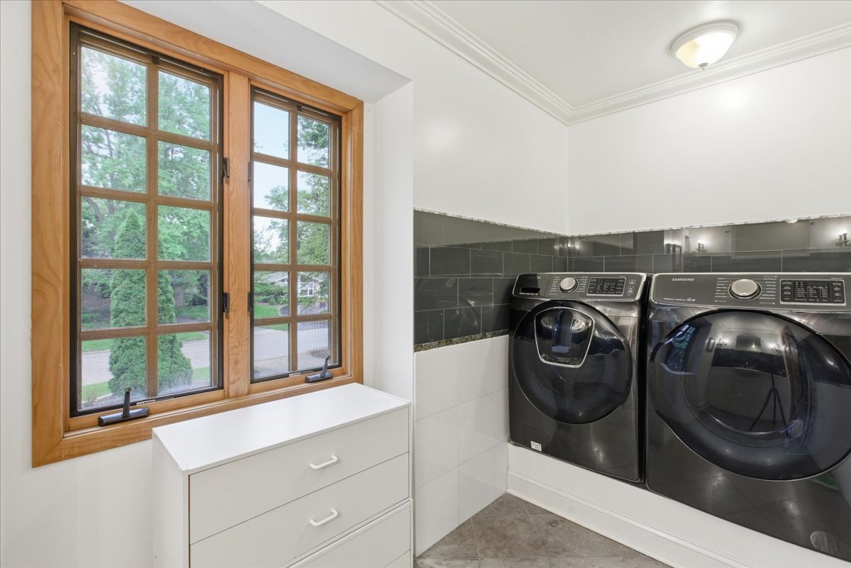 39 Mockingbird Lane Oak Brook, IL 60523 - Photo 41 of 57 a utility room with dryer and washer