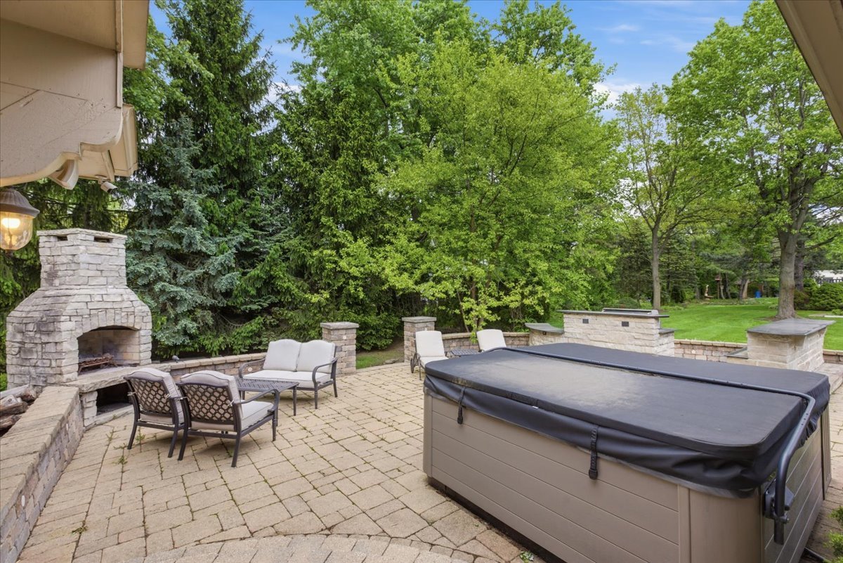 39 Mockingbird Lane Oak Brook, IL 60523 - Photo 50 of 57 a view of a patio with a table and chairs