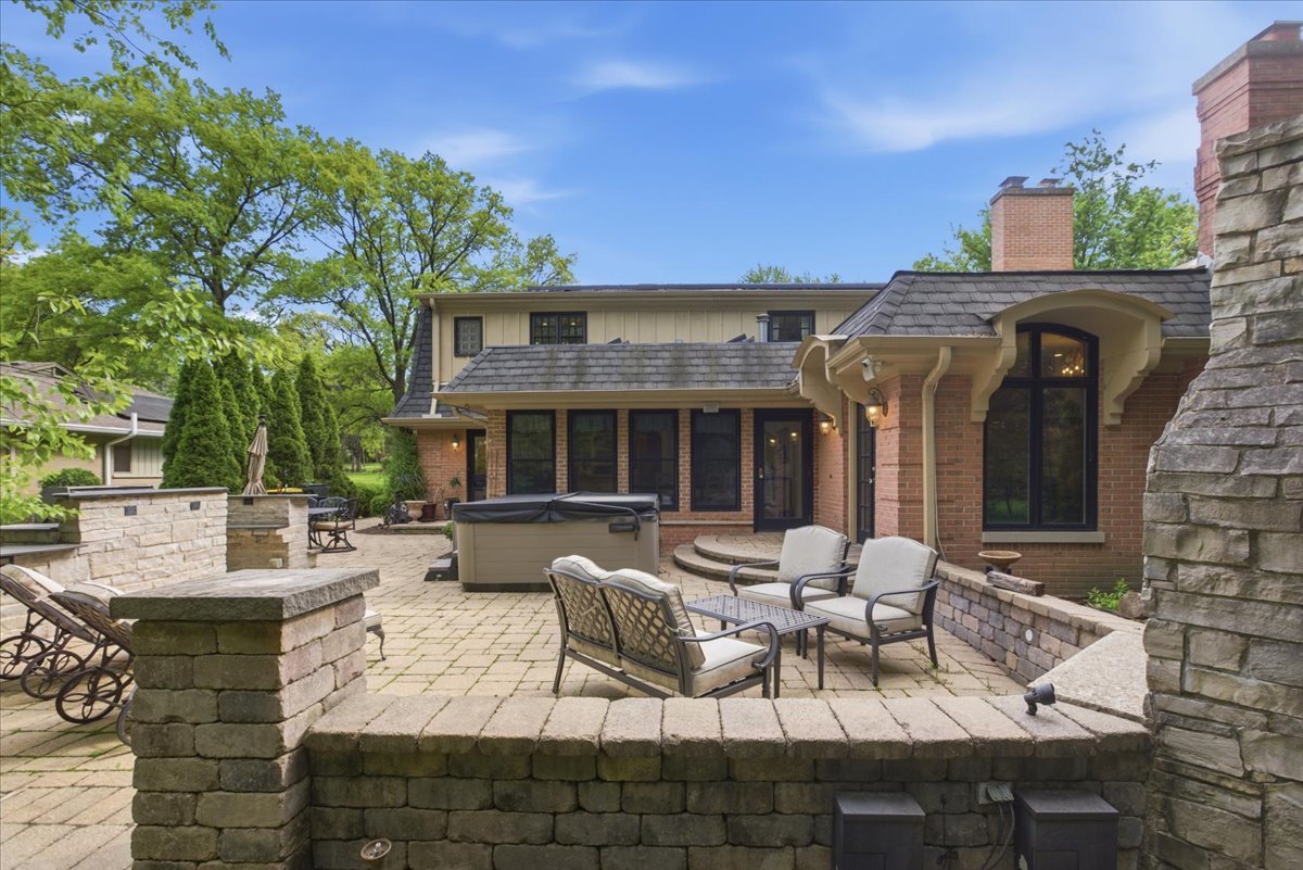 39 Mockingbird Lane Oak Brook, IL 60523 - Photo 5 of 57 a view of a patio with couches table and chairs and potted plants