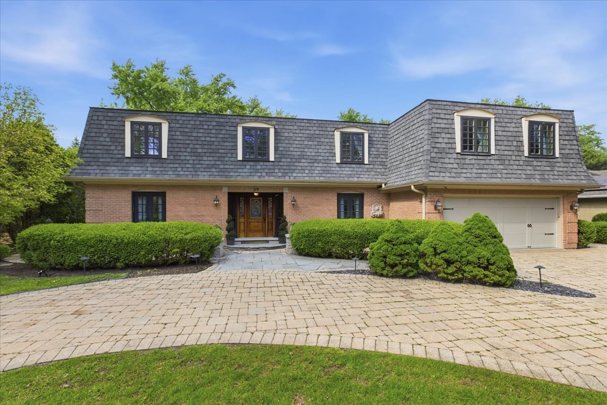 39 Mockingbird Lane Oak Brook, IL 60523 - Photo 52 of 57 a front view of a house with a yard