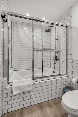 a bathroom with a shower and a toilet
