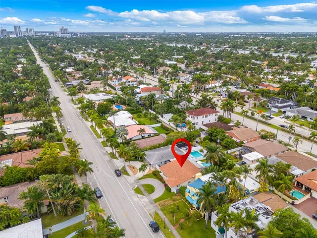 an aerial view of residential houses with outdoor space