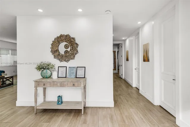 an entryway with wooden floor