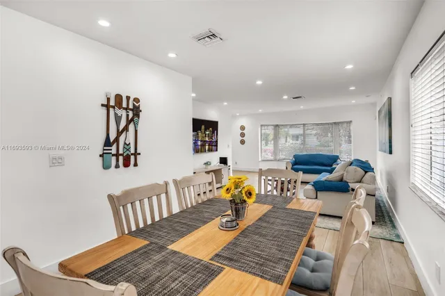 a living room with furniture rug and wooden floor