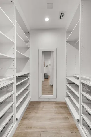 a view of an empty walk in closet