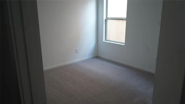 a view of a window in an empty room