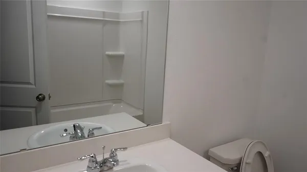 a bathroom with a bathtub and sink