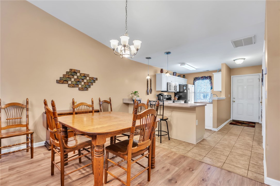 18 Sweetgrass Trail Anderson, SC 29625 - Photo 7 of 26 This inviting dining area seamlessly connects to the kitchen, perfect for everyday living.