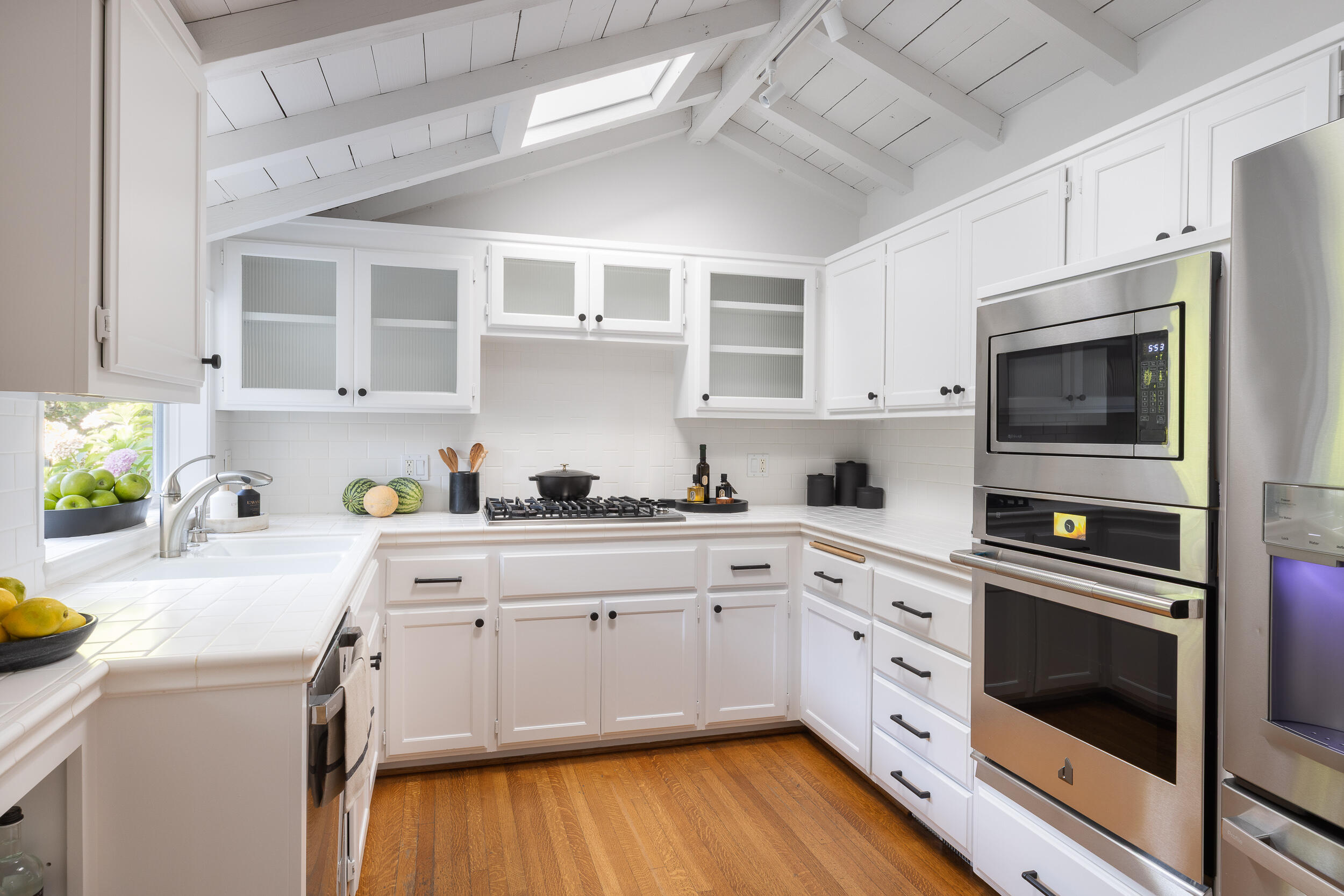1515 East Valley Road, Unit C Santa Barbara, CA 93108 - Photo 12 of 22 a kitchen with a white cabinets and white appliances
