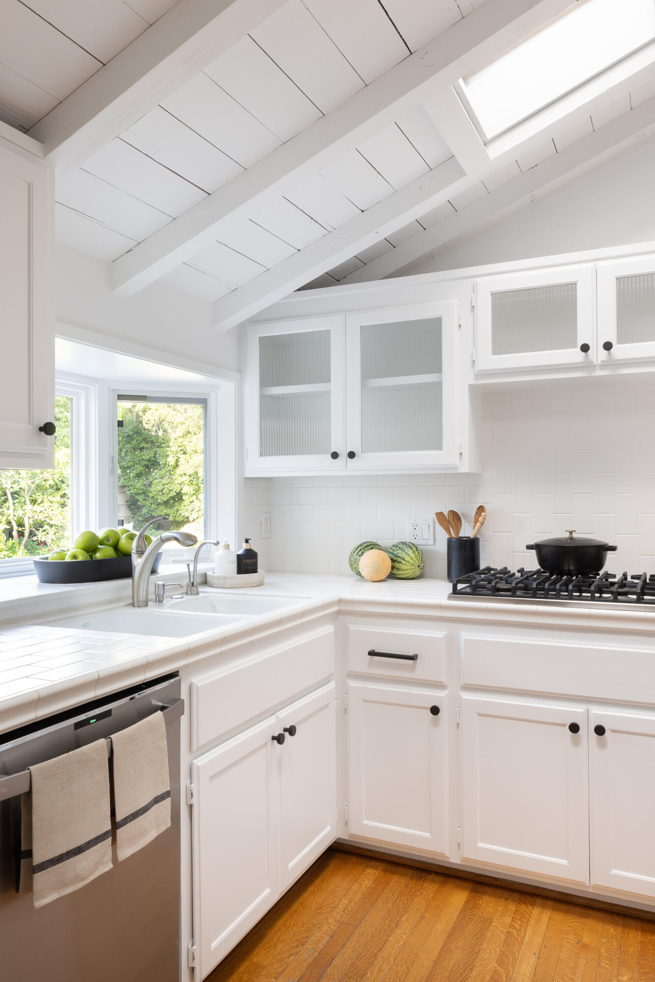 1515 East Valley Road, Unit C Santa Barbara, CA 93108 - Photo 13 of 22 a kitchen with white cabinets and a window