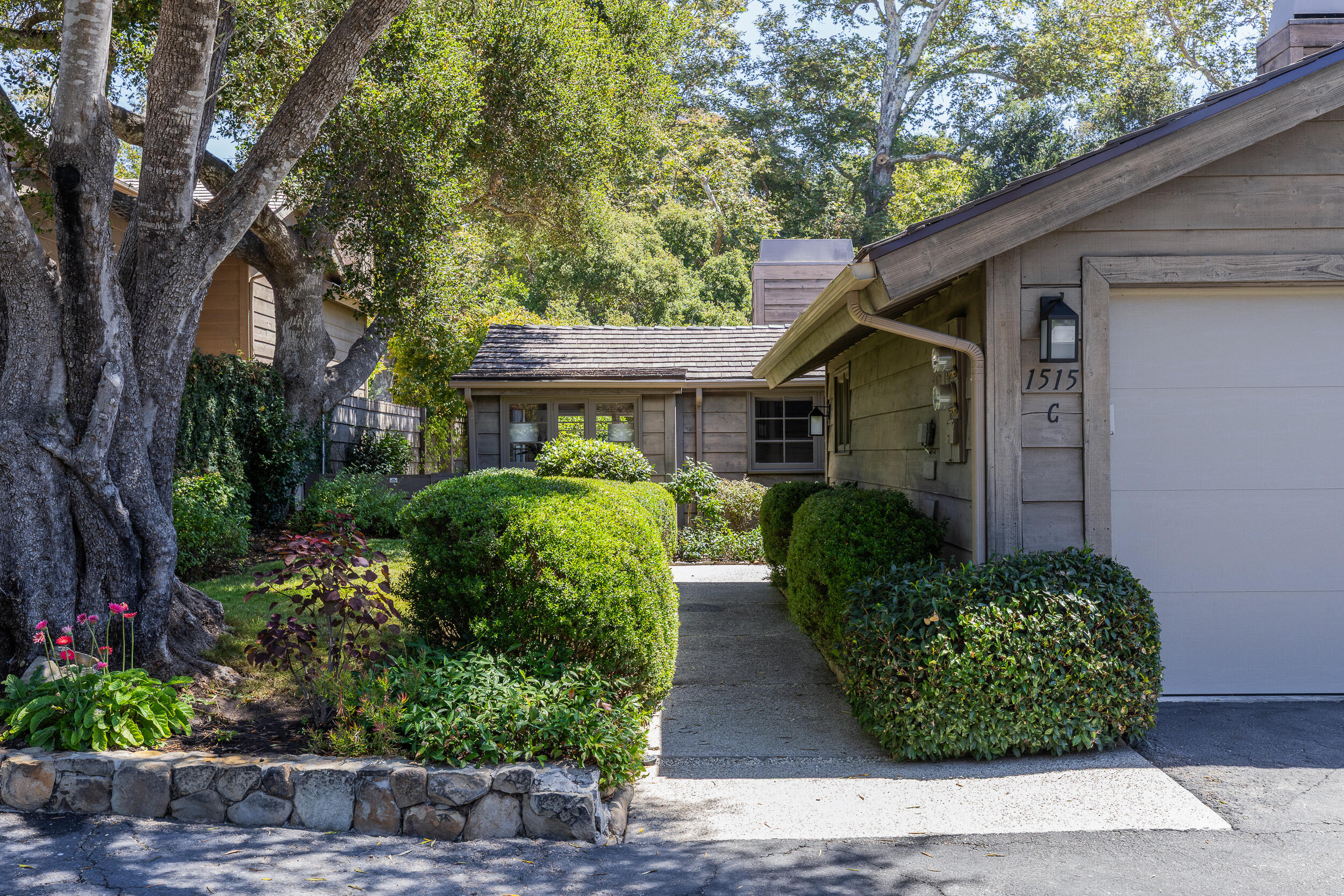 1515 East Valley Road, Unit C Santa Barbara, CA 93108 - Photo 2 of 22 a front view of a house with garden