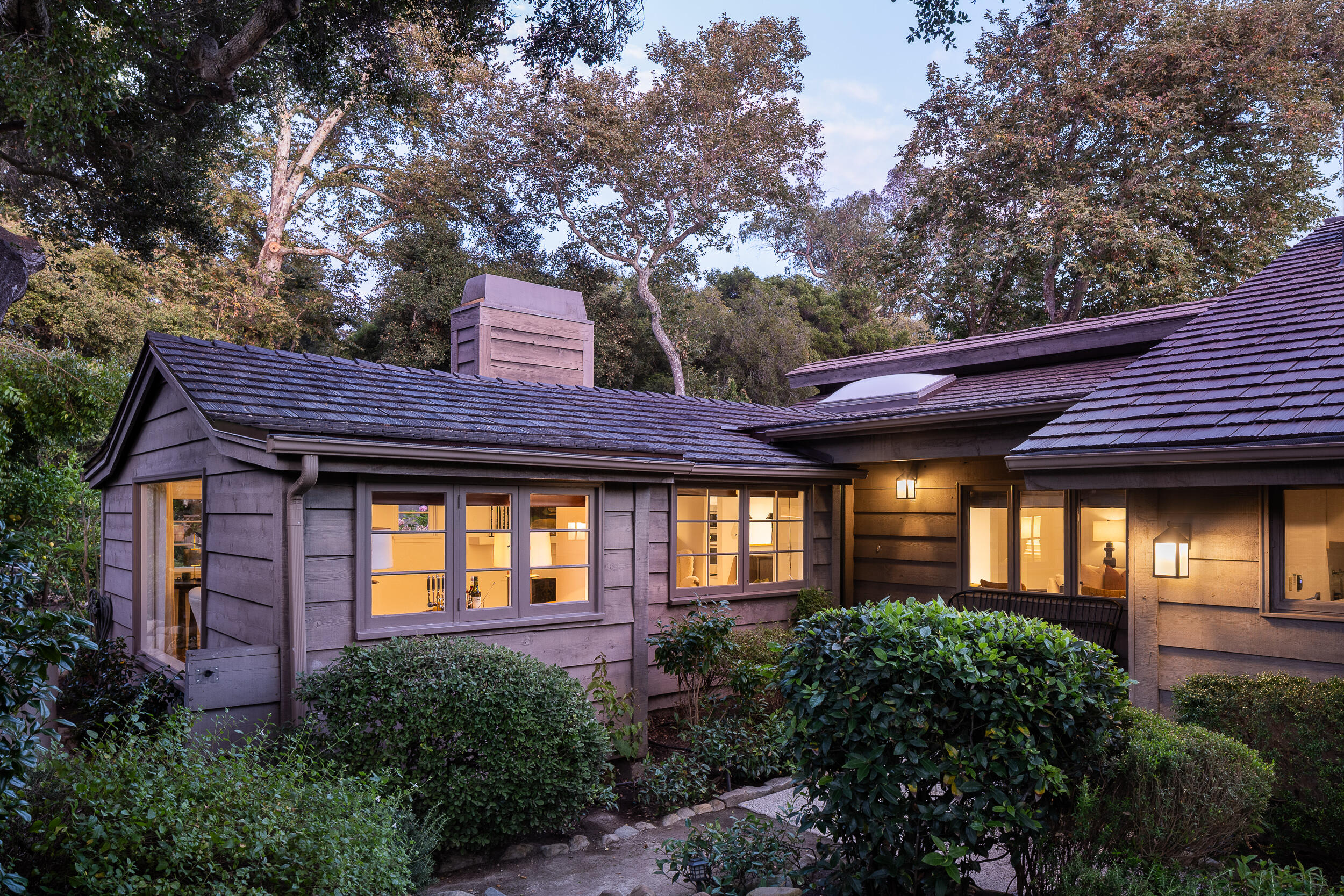 1515 East Valley Road, Unit C Santa Barbara, CA 93108 - Photo 3 of 22 a view of brick house with a large windows and a large tree