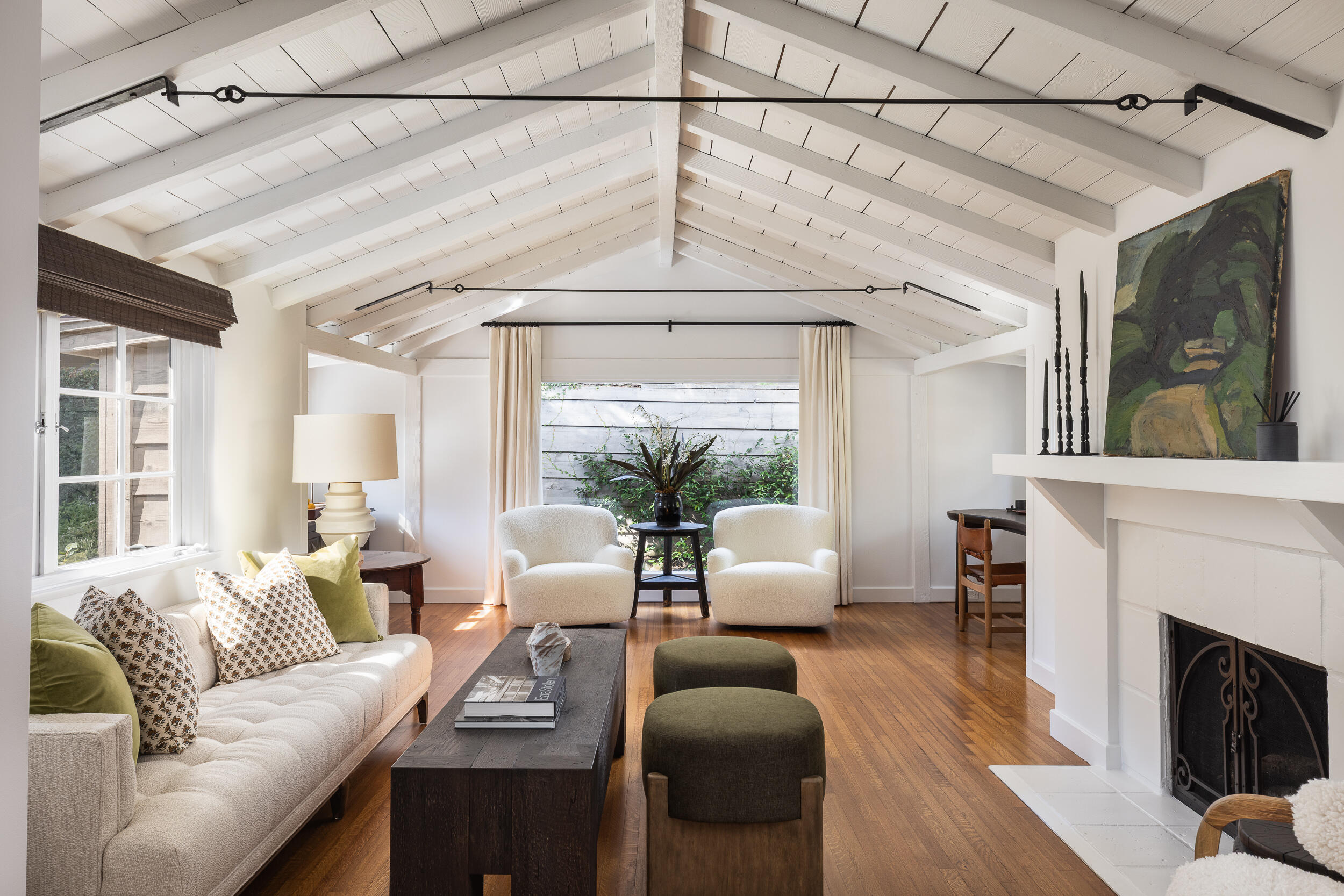 1515 East Valley Road, Unit C Santa Barbara, CA 93108 - Photo 5 of 22 a living room with furniture a fireplace and a chandelier