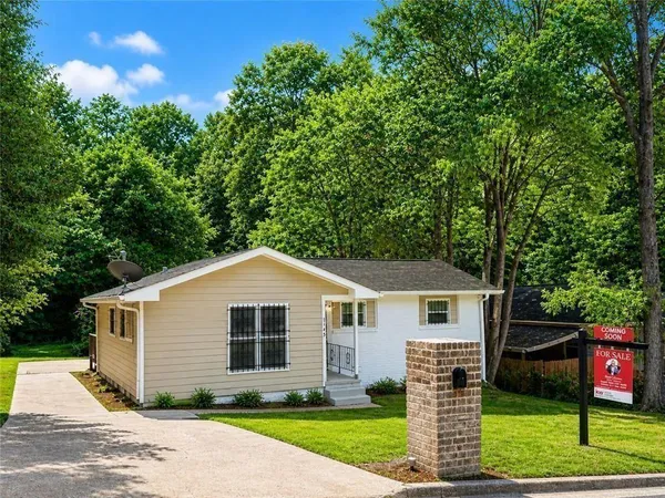a front view of a house with a yard