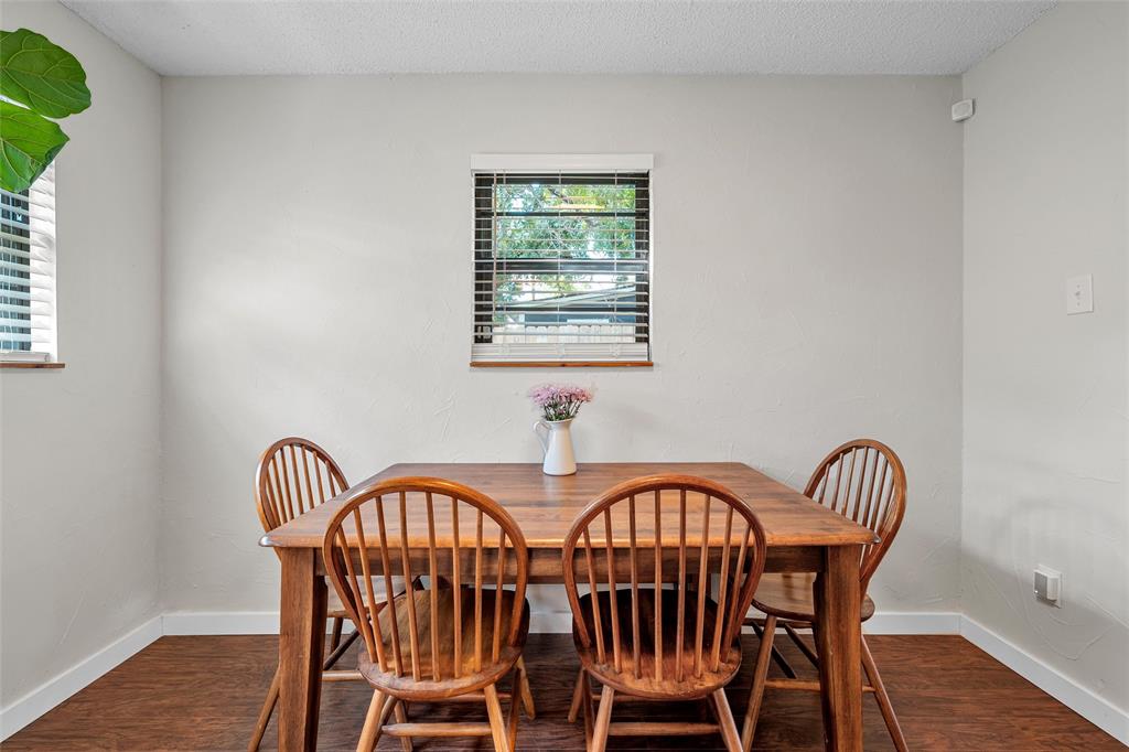 3000 North 15th A Street Waco, TX 76708 - Photo 12 of 24 a view of a a dining room with furniture window and wooden floor