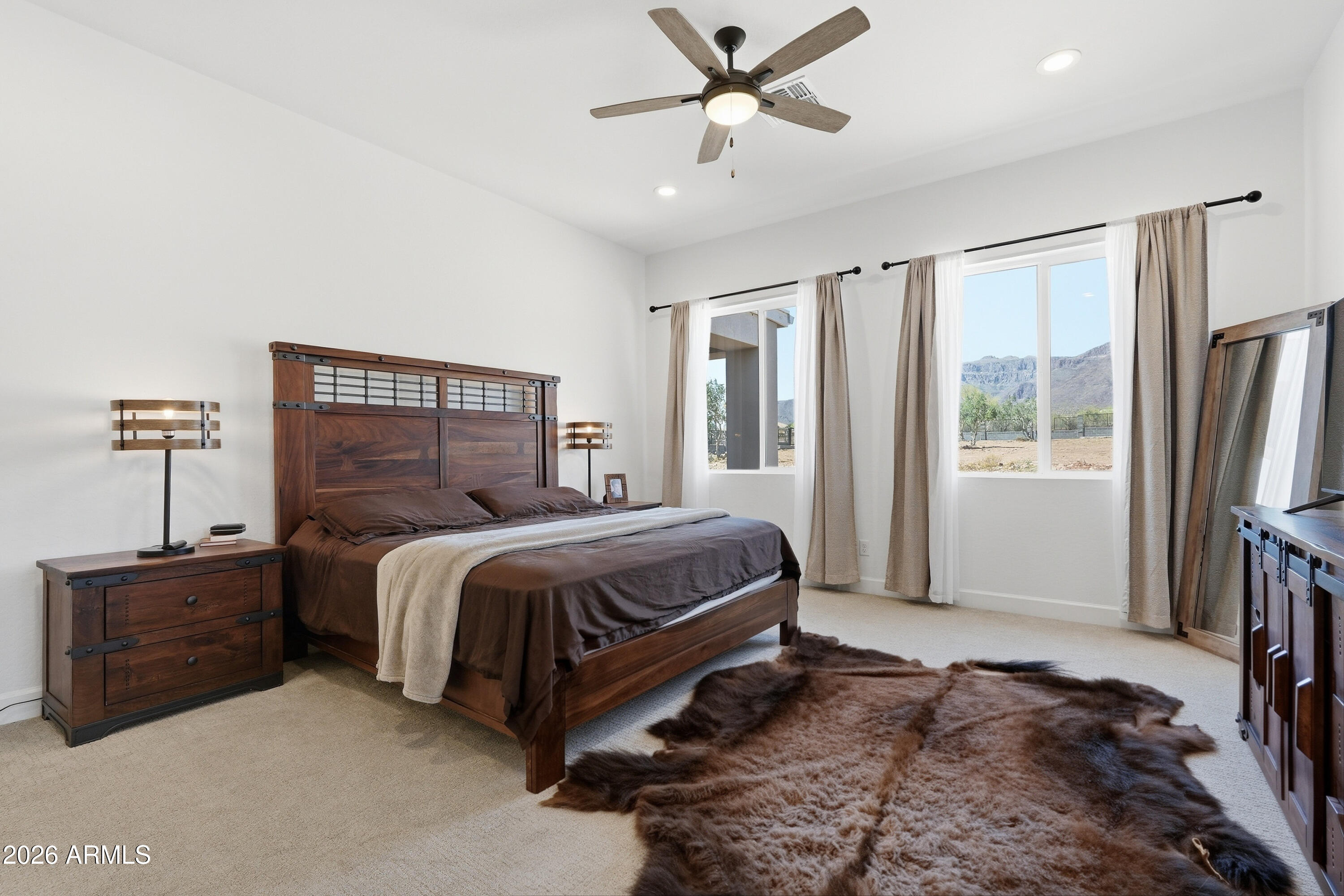 10464 East Magnolia Road Gold Canyon, AZ 85118 - Photo 25 of 77 a bedroom with a bed dresser and a window