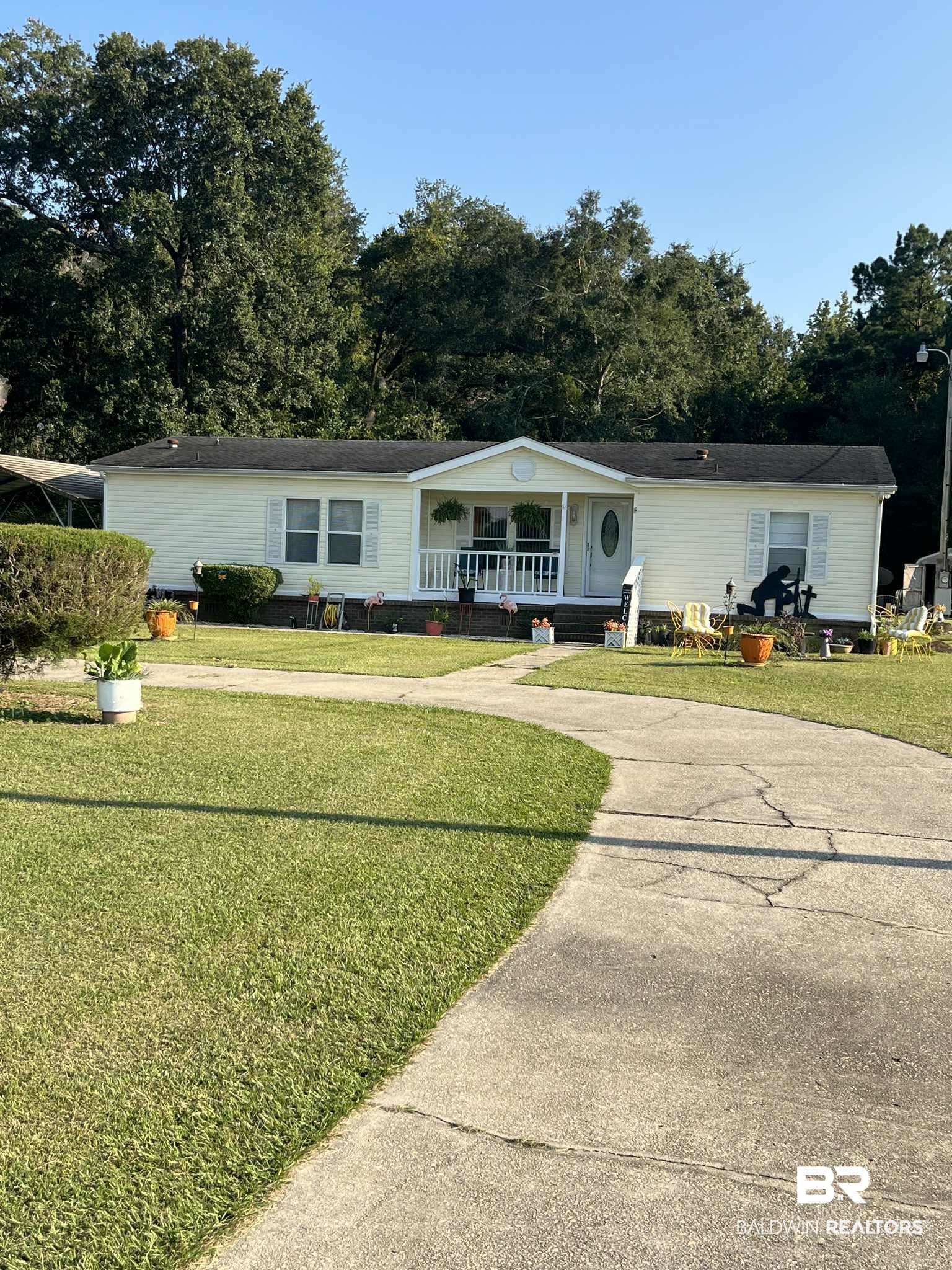 15418 Pine Grove Road Bay Minette, AL 36507 - Photo 18 of 18 View of front of house featuring covered porch and a front yard