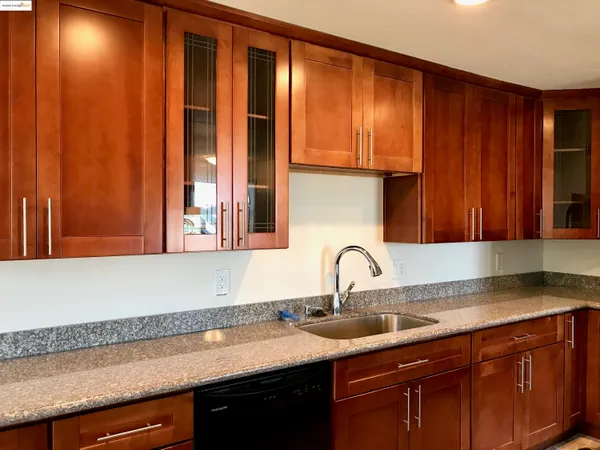 a kitchen with a sink and cabinets