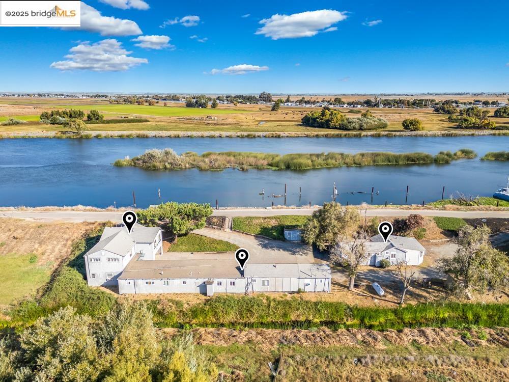 2140 Dutch Slough Road Oakley, CA 94561 - Photo 3 of 24 a view of a lake with a mountain in the background