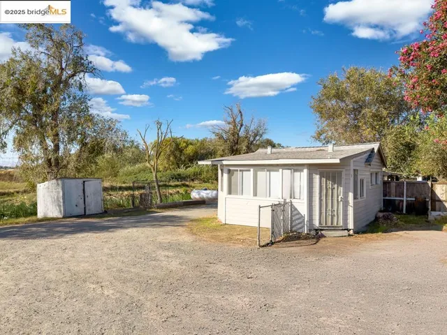 a view of a house with a yard and garage