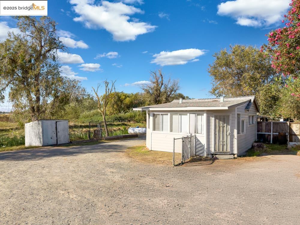 2140 Dutch Slough Road Oakley, CA 94561 - Photo 7 of 24 a view of a house with a yard and garage