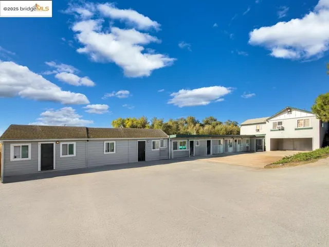 a view of residential houses with city view
