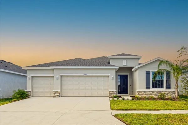 front view of a house with a yard