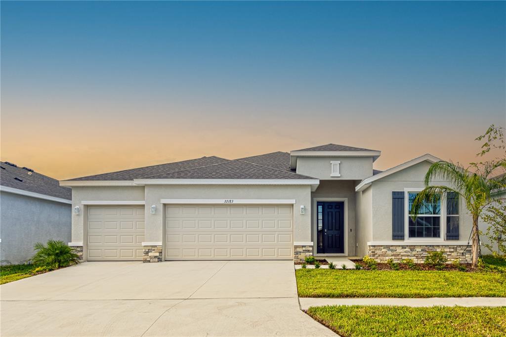 front view of a house with a yard