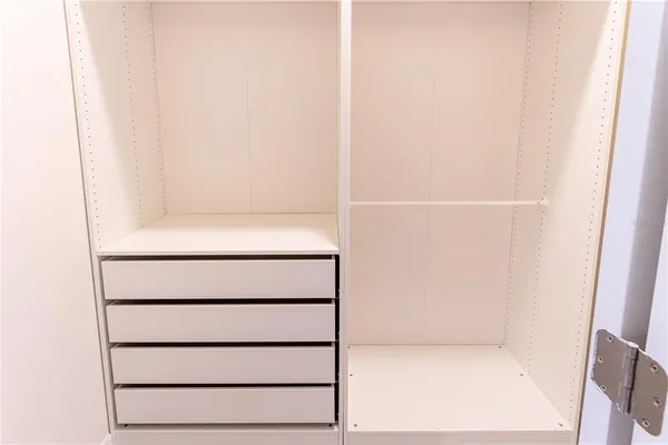 a view of an empty room with windows