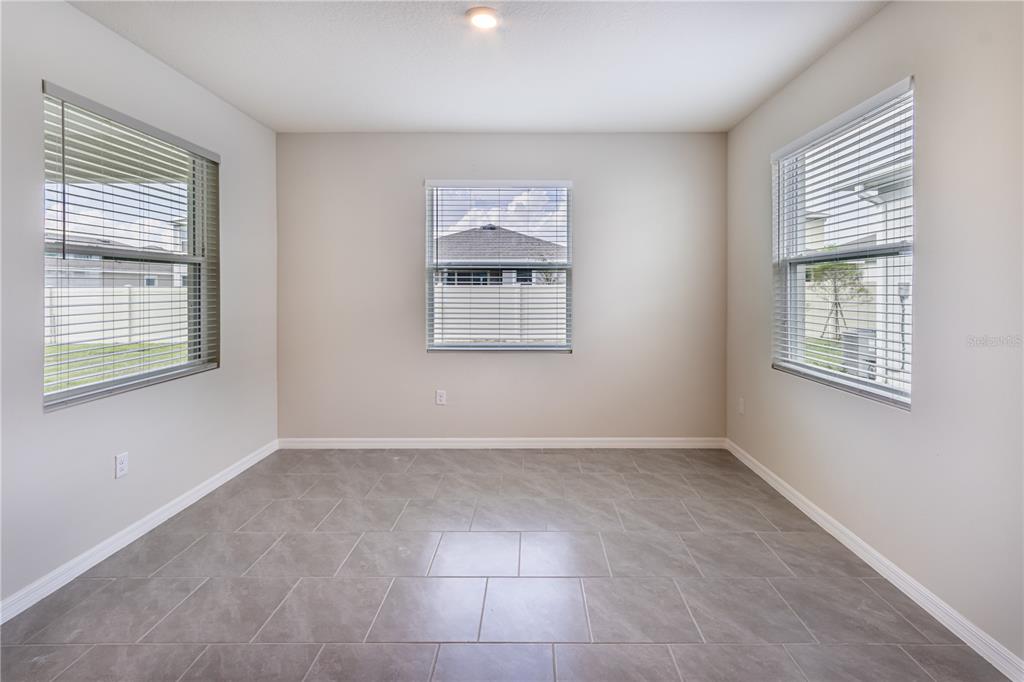 32183 Conchshell Sail Street Wesley Chapel, FL 33545 - Photo 20 of 45 a view of an empty room with a window