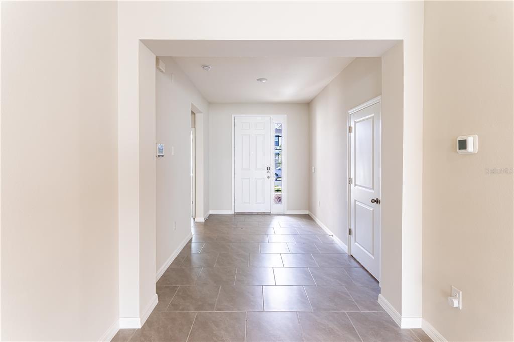 32183 Conchshell Sail Street Wesley Chapel, FL 33545 - Photo 24 of 45 a view of a hallway with wooden floor