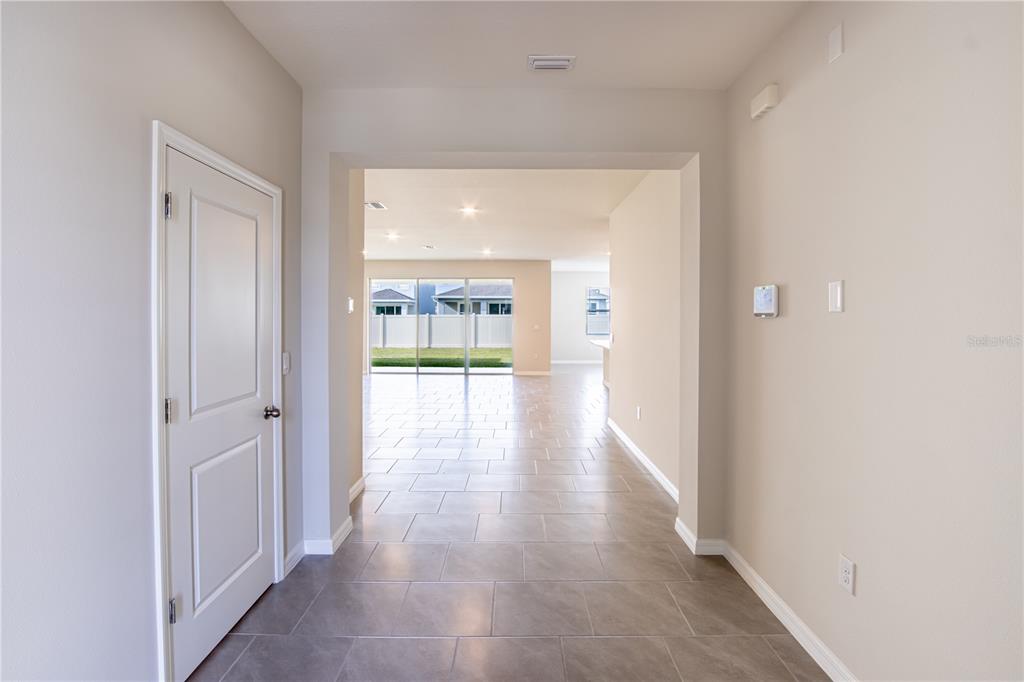 32183 Conchshell Sail Street Wesley Chapel, FL 33545 - Photo 25 of 45 a view of a hallway with wooden floor