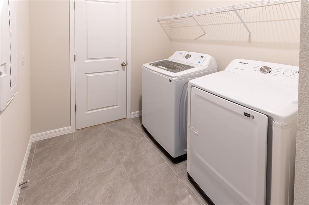 32183 Conchshell Sail Street Wesley Chapel, FL 33545 - Photo 33 of 45 a view of storage and utility room with washer and dryer