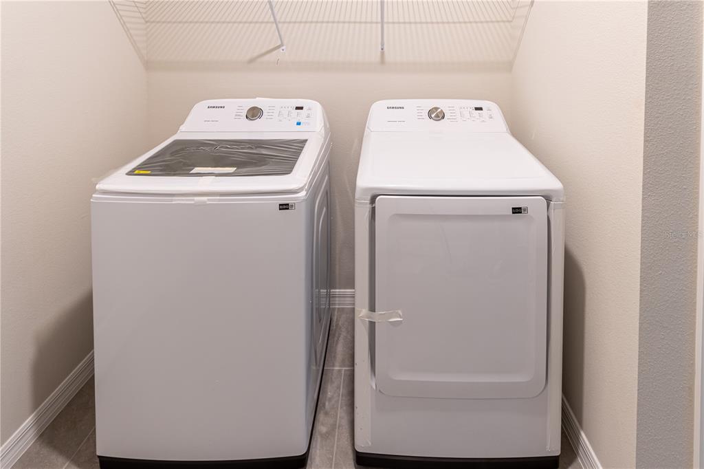 32183 Conchshell Sail Street Wesley Chapel, FL 33545 - Photo 34 of 45 a utility room with dryer and washer