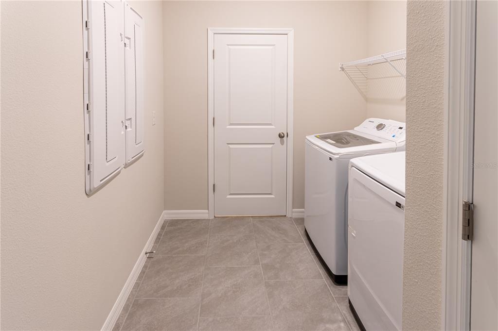 32183 Conchshell Sail Street Wesley Chapel, FL 33545 - Photo 35 of 45 a utility room with dryer and washer