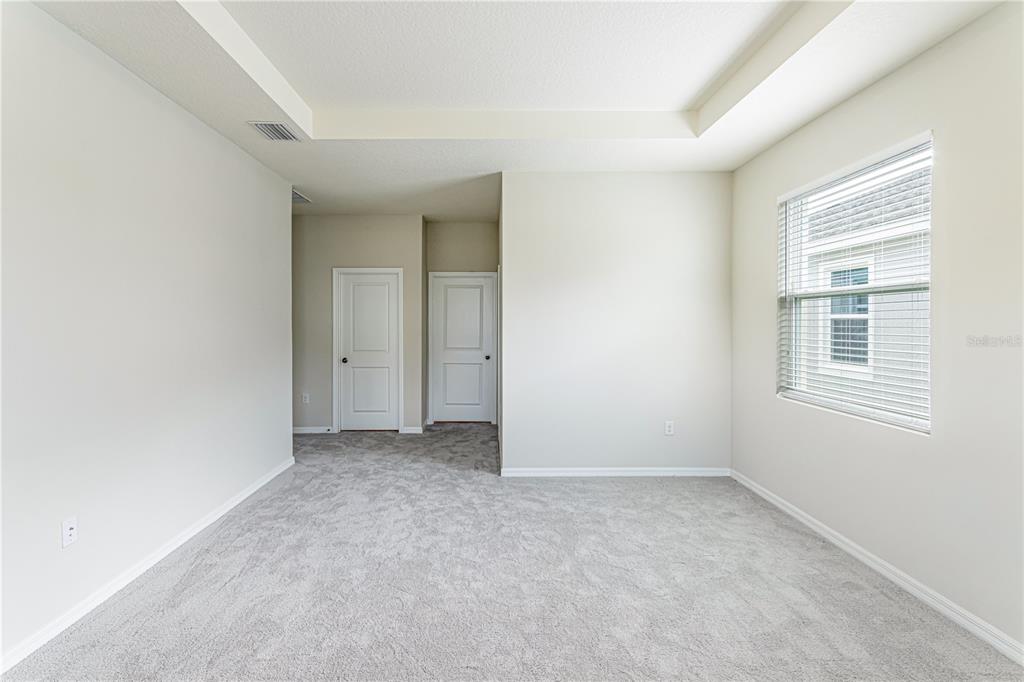 32183 Conchshell Sail Street Wesley Chapel, FL 33545 - Photo 40 of 45 an empty room with windows