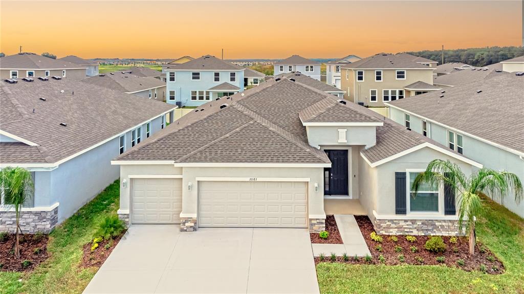 32183 Conchshell Sail Street Wesley Chapel, FL 33545 - Photo 44 of 45 front view of a house with a yard