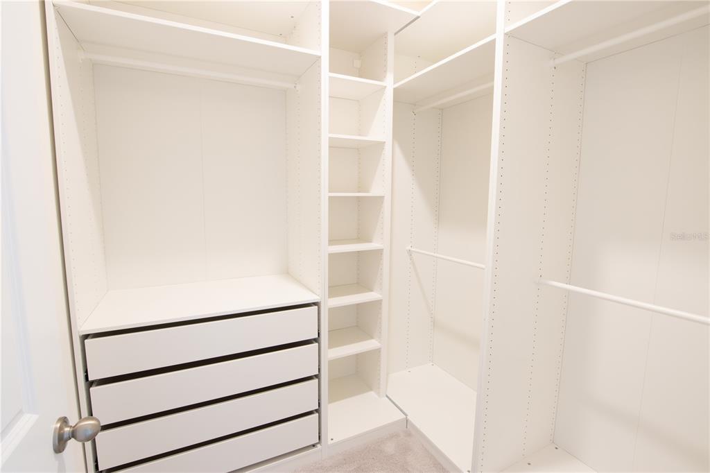 32183 Conchshell Sail Street Wesley Chapel, FL 33545 - Photo 7 of 45 a close up view of walk in closet with empty racks