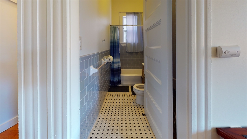 591 Beacon Street, Unit 7 Boston, MA 02215 - Photo 4 of 5 a bathroom with a sink and a toilet