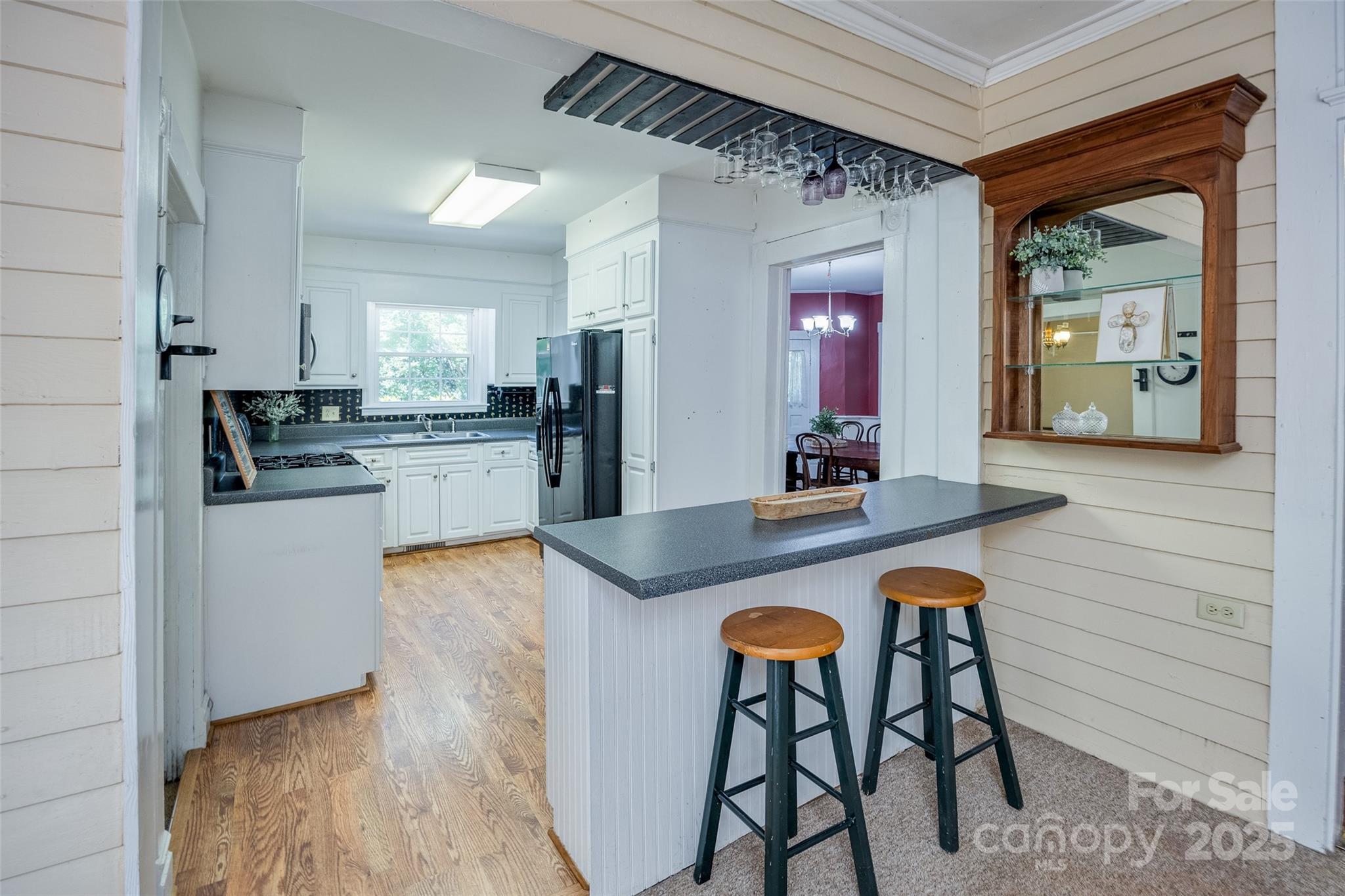 274 Old Harden Road Winnsboro, SC 29180 - Photo 11 of 39 a kitchen with stainless steel appliances granite countertop wooden cabinets a stove a sink and a refrigerator